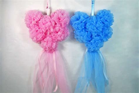 Fiocco nascita rosa e azzurro su una porta di casa