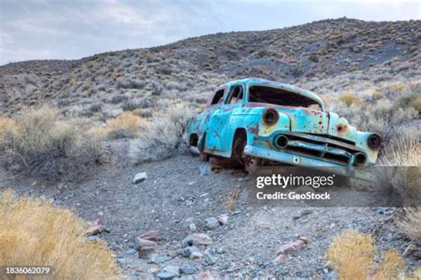 Desert landscape with a wrecked vehicle